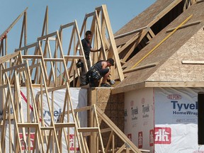 Framers are shown working on a new home in Lakeshore on June 8, 2017.