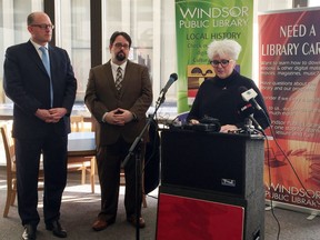 Mayor Drew Dilkens and Ron Dunn, executive director of the Downtown Mission, look on as Kitty Pope, chief executive officer Windsor Public Library,       speaks March 2 at an announcement that the library's Ouellette Avenue building is being sold to the Mission.