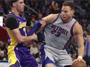 Detroit Pistons forward Blake Griffin (23) attempts to drive around Los Angeles Lakers guard Lonzo Ball (2) during the first half of an NBA basketball game, Monday, March 26, 2018, in Detroit.