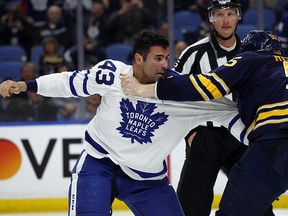 Buffalo Sabres Rasmus Ristolainen (55) and Toronto Maple Leafs Nazem Kadri (43) fight Monday, March. 5, 2018, in Buffalo, N.Y. (AP Photo/Jeffrey T. Barnes)