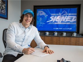 LaSalle native Luke Willson signs his contract with the Detroit lions in Allen Park, Michigan on March 21, 2018.