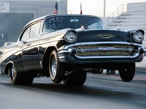 A 1957 Chevy owned by Russell Woods lifts off at the start of a race during the Windsor weekend at the Grand Bend Motorplex in 2003.