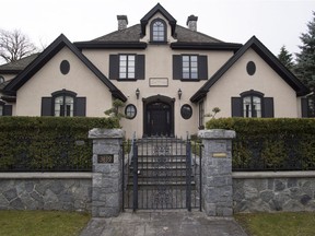 The former owner of this mansion in Vancouver's exclusive Shaughnessy neighbourhood, shown March 13, 2018, must repay a $300,000 deposit after the sale of the property fell through because she didn't tell the buyer about a suspected gang-related murder of her son-in-law at the front gate of the home.