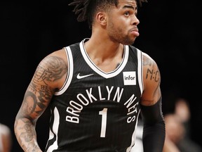 Brooklyn Nets guard D'Angelo Russell (1) reacts a s he looks at his points total during the first half of an NBA basketball game against the Toronto Raptors, Tuesday, March 13, 2018, in New York.