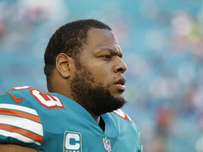 This Dec. 31, 2017 photo shows Miami Dolphins defensive tackle Ndamukong Suh (93) during the first half of an NFL football game against the Buffalo Bills in Miami Gardens, Fla. The Los Angeles Rams agreed to terms with Suh on a one-year contract Monday, March 26, 2018. The star defensive tackle will play alongside All-Pro Aaron Donald on the Rams' defensive line.