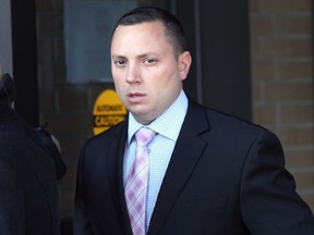 Ontario Provincial Police Const. Jamie Porto leaves the Superior Court in Windsor on Nov. 15, 2016. He is on trial for dangerous operation of a motor vehicle for a 2014 crash in St. Joachim.