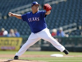 Texas Rangers starting pitcher Bartolo Colon throws during the first inning of a spring training baseball game against the San Diego Padres on March 1, 2018 in Surprise, Ariz.