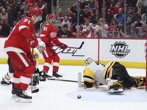 Detroit Red Wings center Frans Nielsen (51) watches as his goal rebounds out of the net past Pittsburgh Penguins goaltender Matt Murray after his goal during the second period of an NHL hockey game, Tuesday, March 27, 2018, in Detroit.