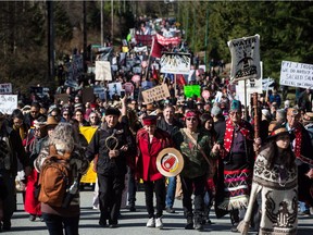 Thousands of people march together during a protest against the Kinder Morgan Trans Mountain pipeline expansion in Burnaby, B.C., on March 10, 2018. Indigenous leaders and environmentalists beat drums and sang as they protested Kinder Morgan's $7.4B pipeline in southern B.C.
