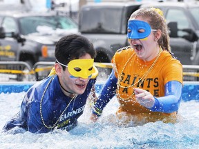 The 4th annual Polar Plunge Windsor-Essex in support of Special Olympics Ontario was held on March 2, 2018, at the St. Clair College SportsPlex. A pair of masked students from St. Anne high school react to the cold water during the event.