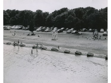 Sunbathers and swimmers hit the beach at Point Pelee National Park.