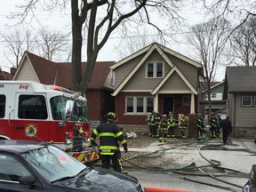 Windsor firefighters clear the scene after dealing with a house fire at 728 Rankin Ave. on March 8, 2018.