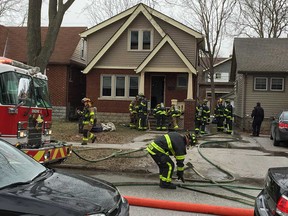 Windsor firefighters clean up after dealing with a house fire at 728 Rankin Ave. on the morning of March 8, 2018.