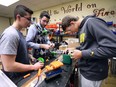 The Sandwich Secondary School's Robotics team, "Sabre Bytes" is one of the most established local teams and has been to the world championships before. They hope to make it to Detroit this year where the 2018 FIRST Robotics Global Championships are being held. Students Steven Ward, left, Luke Rimak, centre and Brad Learn work on an intake system for a robot on Tuesday, March 6, 2018.