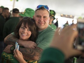 Shawna and Bob Hogan pose for a photo while celebrating St. Patrick's Day in an outdoor tent at O'Maggio's Kildare House in Windsor on March 17, 2018.