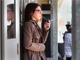 Kati Panasiuk, a St. Clair College student in the media convergence program, smokes a cigarette outside of the school's MediaPlex in downtown Windsor on Monday, March 26, 2018.