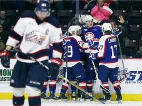 The Windsor Spitfires celebrate Jake Smith's first-period goal in a 3-2 win over the Saginaw Spirit on Sunday. Windsor will now face Sarnia in the first round of the playoffs.