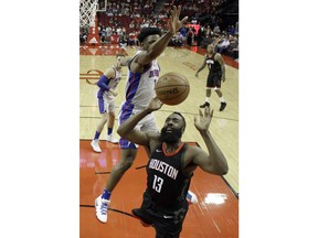 Houston Rockets' James Harden (13) loses the ball as Detroit Pistons' Stanley Johnson (7) defends during the first half of an NBA basketball game Thursday, March 22, 2018, in Houston.