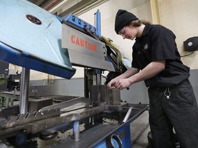Unique Tool and Gauge in Windsor has created a new one-year program to train high school, college and non-students to help fill the skills gap. Reed Remillard, a Grade 11 student from Herman Secondary School works on the shop floor on Tuesday, March 6, 2018.