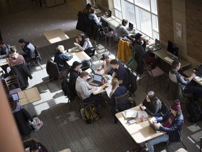 Students hang out in the Odette School of Business common area on March 14, 2018, the day after a woman was severely burned on an upper floor.
