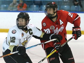 Leamington Flyers defenceman Bryce O'Brien, left, battles with LaSalle Vipers captain Eric Kirby earlier this season.