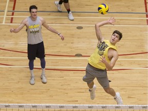 The Windsor Lancers' Pierce Johnson spikes the ball during practice on Thursday at the SportsPlex as the team prepares to face McMaster on Friday looking for a spot at the national championship.