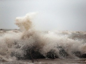 Shoreline residents are being warned of strong winds from the southwest developing Saturday afternoon. Here, raging Lake Erie waves driven by gusty winds crash on the shore in Leamington, Dec. 28, 2015.