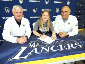 Massey Mustangs and Windsor Legion standout Chloe Walker, centre, signs to run with University of Windsor Monday. Joining Walker were track coaches Gary Malloy, left, and Colin Inglis at St. Denis Centre. (NICK BRANCACCIO/Windsor Star).