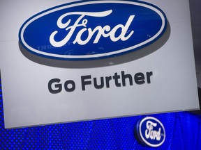 (FILES) This file photo taken on January 10, 2017 shows the Ford logo seen during the 2017 North American International Auto Show in Detroit, Michigan.