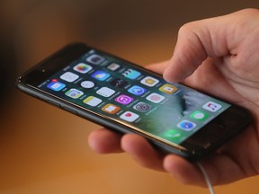 An Apple iPhone. Apple is looking to generate more revenue from online content and services.