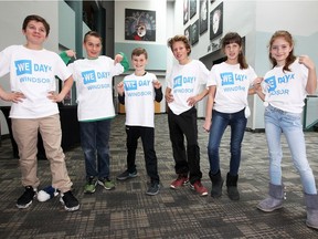 St. William Catholic Elementary students Connor Paronuzzi, left, Henrik Jurkovic, Evan MacPherson, Brady Eagen, Kate Fase and Maya Bandic pose with their WE Day T-shirts during a break at Chrysler Theatre on April 6, 2018. WE Day is an educational event encouraging young people to lead local and global change.