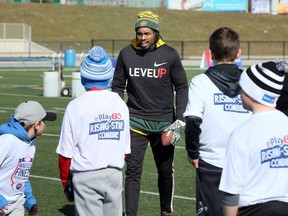 Local football product Arjen Colquhoun, centre, now a member of Edmonton Eskimos, assists with coaching at Windsor's Finest Football Academy camp at University of Windsor's Alumni Field on April 7, 2018.
