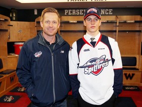 Windsor Spitfires first-round pick Jean-Luc Foudy, right, meets up with Spitfires head coach Trevor Letowski after being selected 10th overall by the club in Saturday's OHL Draft.