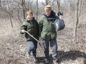 Volunteers Liz and Hugh Kent picked up a garbage bag of broken plastics during spring clean up of Black Oak Heritage Park organized by the Friends of Ojibway Prairie and Friends of Black Oaks on April 8, 2018.