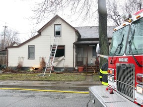 Windsor firefighters and fire investigators remain on the scene of a house fire on Parent Avenue at University Avenue on April 15, 2018.