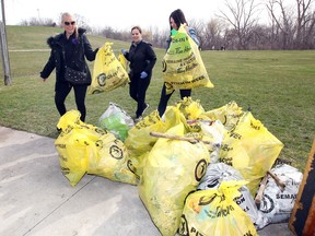 Walking in Her Footsteps clean up volunteers Debbie Smeeton, left, Heather McAuley and Kelly Fraser collect trash in the Little River Park grounds near the toboggan hill on April 21, 2018. Two local community pages, W.E. Put the WIN in Windsor-Essex and Eyes on Windsor hosted the Ganatchio Trail cleanup April 21 from 9 a.m. - noon, supported by Essex Region Conservation and The City of Windsor, in partnership with local Riverside businesses.