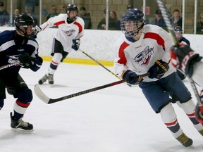 Windsor Spitfires first-round pick Jean-Luc Foudy, centre, cuts through traffic during a scrimmage at the team's minicamp last month at the WFCU Centre.