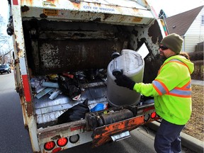 Driver loader with GFL picks up garbage on the 1200 block of Partington Avenue Monday February 22, 2016.