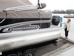 Jan Wilson, City of Windsor corporate leader for parks, recreation, culture and facilities, checks out a new 23-foot Princecraft pontoon boat at Lakeview Park Marina. The boat will ferry passengers to Peche Island and back.