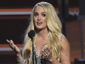 Carrie Underwood accepts the award for vocal event of the year for "The Fighter" at the 53rd annual Academy of Country Music Awards at the MGM Grand Garden Arena on Sunday, April 15, 2018, in Las Vegas.
