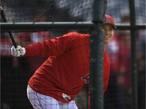 Starting pitcher Shohei Ohtani of the Los Angeles Angels of Anaheim looks at a ball hit into foul territory from the batting cage before playing San Francisco Giants at Angel Stadium on April 21, 2018 in Anaheim, California.