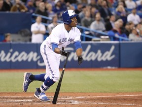 Curtis Granderson of the Toronto Blue Jays hits a game-winning solo home run in the tenth inning during MLB game action against the Boston Red Sox at Rogers Centre on April 24, 2018 in Toronto, Canada.