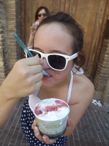 In Italy, Amanda enjoys some gelato.