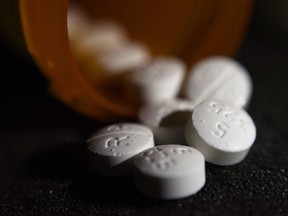 An arrangement of pills of the opioid oxycodone-acetaminophen is shown in this file photo.
