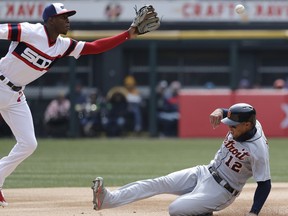 Detroit Tigers' Leonys Martin, right, steals second base as Chicago White Sox shortstop Tim Anderson tries to catch the ball during the first inning of a baseball game Sunday, April 8, 2018, in Chicago.