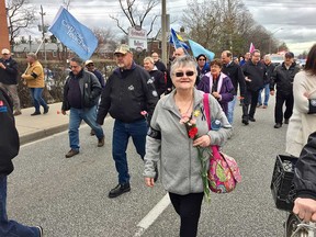 Sandy Marentette, wife of the late long-time activist Rolly Marentette, takes part in Windsor's march for the national Day of Mourning on April 28, 2018.