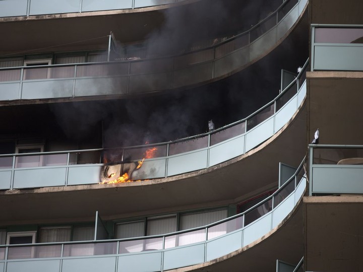  A fire burns on the 12th floor of the Le Goyeau condominium building at 111 Riverside Dr. East, Tuesday, April 17, 2018.