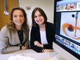 Wren Montgomery, left, assistant professor of Management at the University of Windsor's Odette School of Business, and recent graduate Natalina Aquino are shown at Montgomery's office on Monday, April 16, 2018. Their research on the Flint water crisis was published recently in Sage Publishing.