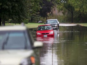 Stranded vehicles in flood water on Everts Avenue in Windsor on Aug. 29, 2017, following torrential rainfall.