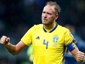 In this image taken on Monday, Nov. 13, 2017 Sweden's Andreas Granqvist celebrates at the end of the World Cup qualifying play-off second leg soccer match between Italy and Sweden, at the Milan San Siro stadium, Italy, Monday, Nov. 13, 2017. Four-time champion Italy has failed to qualify for World Cup; Sweden advances with 1-0 aggregate win in playoff.